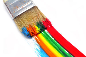 a brush with paint and brushstrokes of different colors in a white background